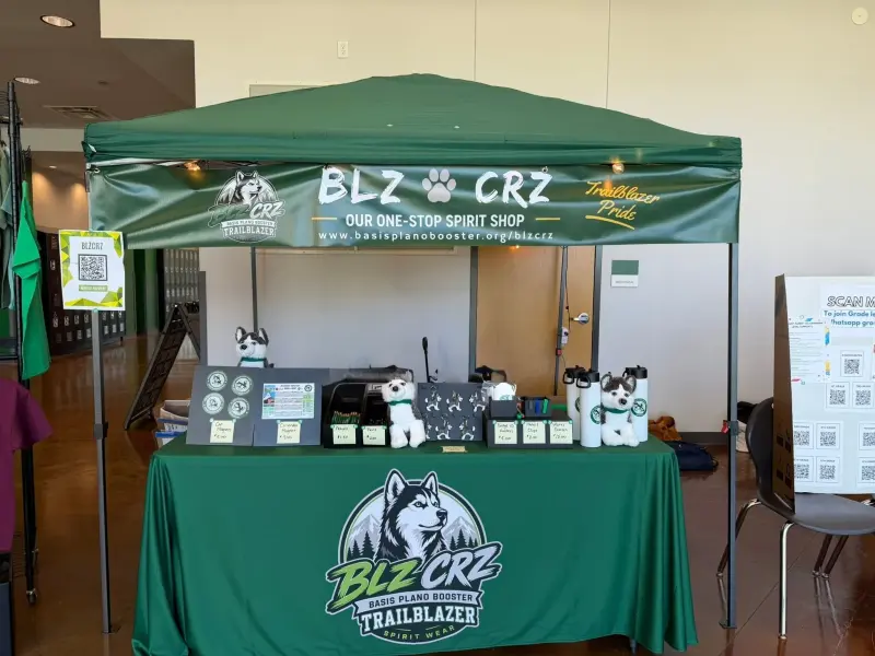 The spirit shop stall seen head on, its banner reading “BLZ CRZ — our one-stop spirit shop”